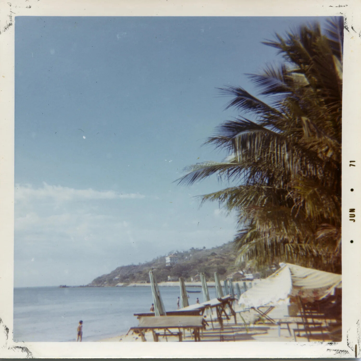 Beach Resort Scene with Palm Tree and Cabanas, Coastal Vietnam, 1971