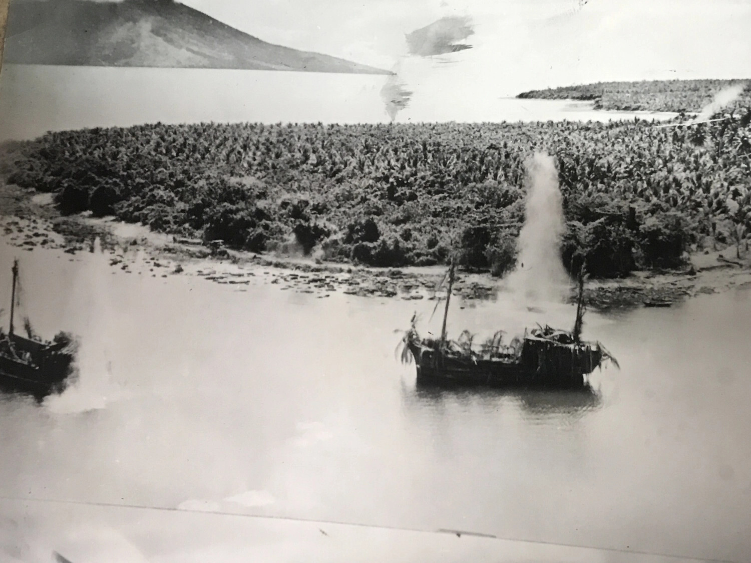 Aerial Strike Photograph: B-25 Attack on Camouflaged Japanese Coastal Barges