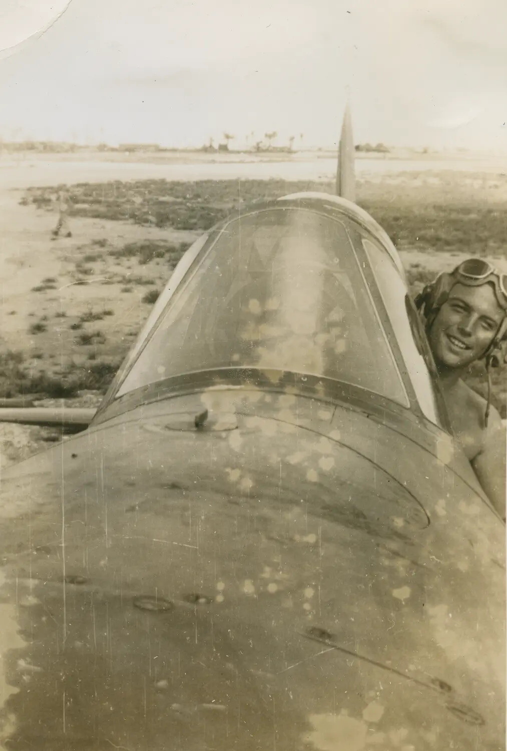 Pilot Leaning from Cockpit of Single-Engine Aircraft, Pat McAleer Collection
