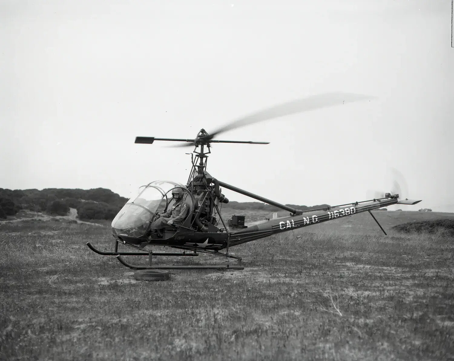 California National Guard Hiller OH-23 Raven Helicopter in Flight Over Field