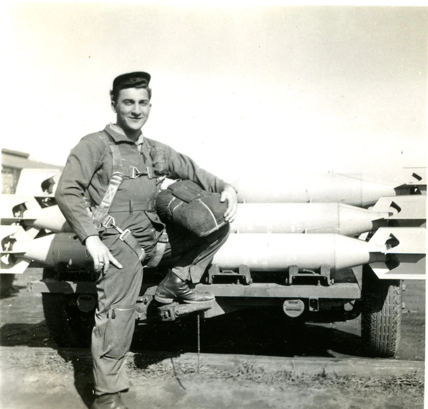 U.S. Army Air Forces Airman Posing with Bomb Trailer, 345th Bomb Group, WWII Pacific Theater