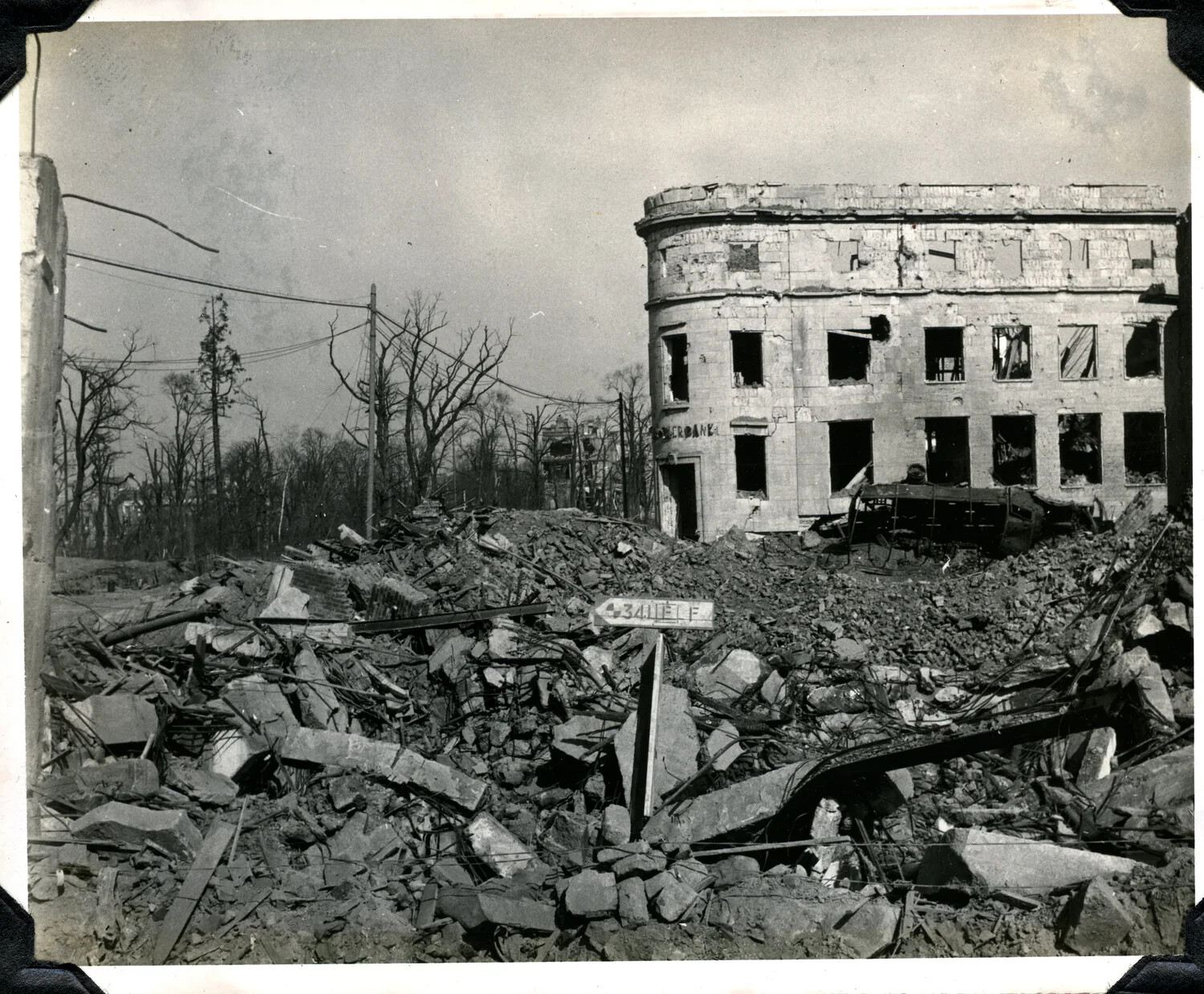 Bomb-Damaged European City Street with Ruined Bank Building, U.S. Army Signal Corps Photograph