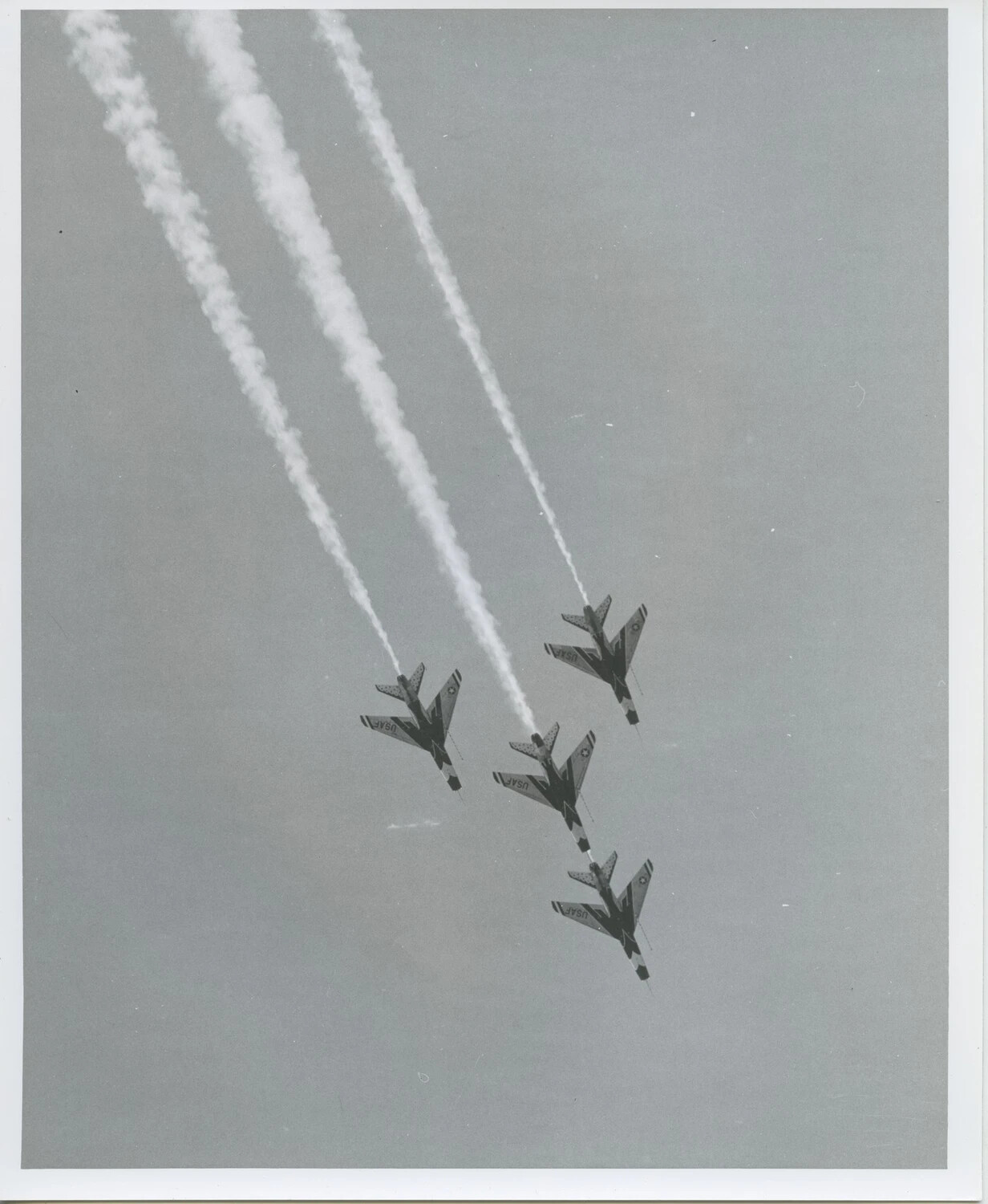 Thunderbirds F-100 Super Sabres in Diamond Formation with Smoke Trails, Top View