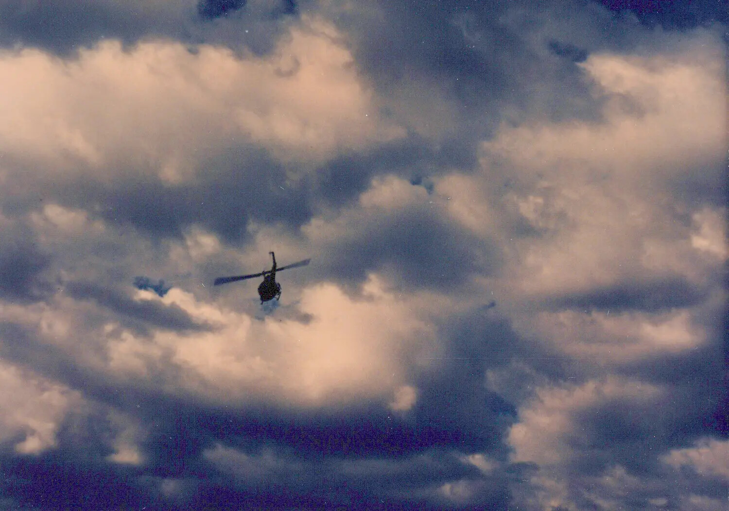 UH-1 Huey Helicopter in Flight Against Cloud Formation, Cu Chi, Vietnam, 1967