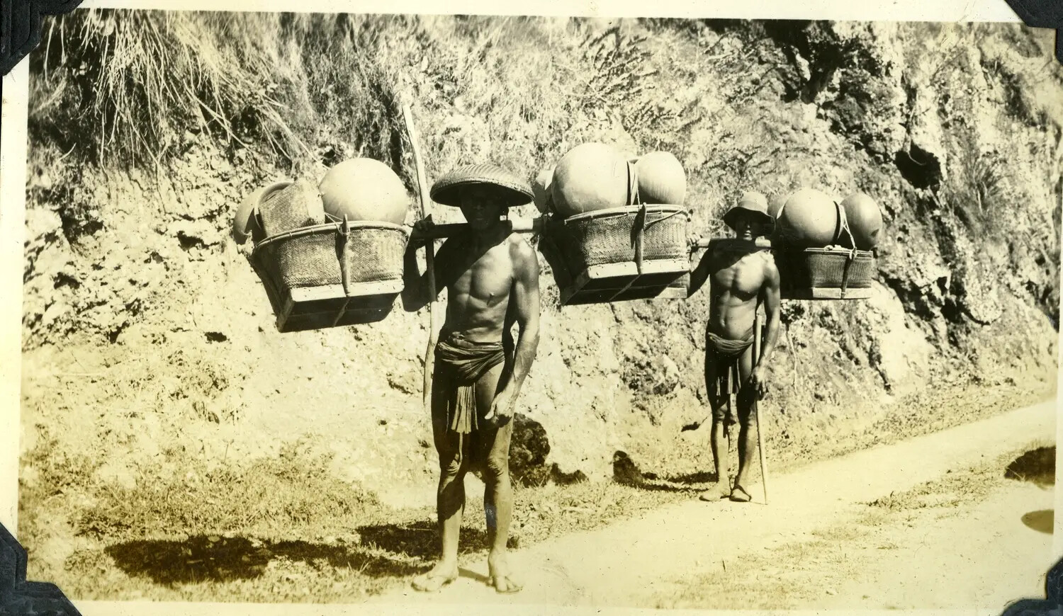 Porters Carrying Jars on Shoulder Poles, Manila Photo Album