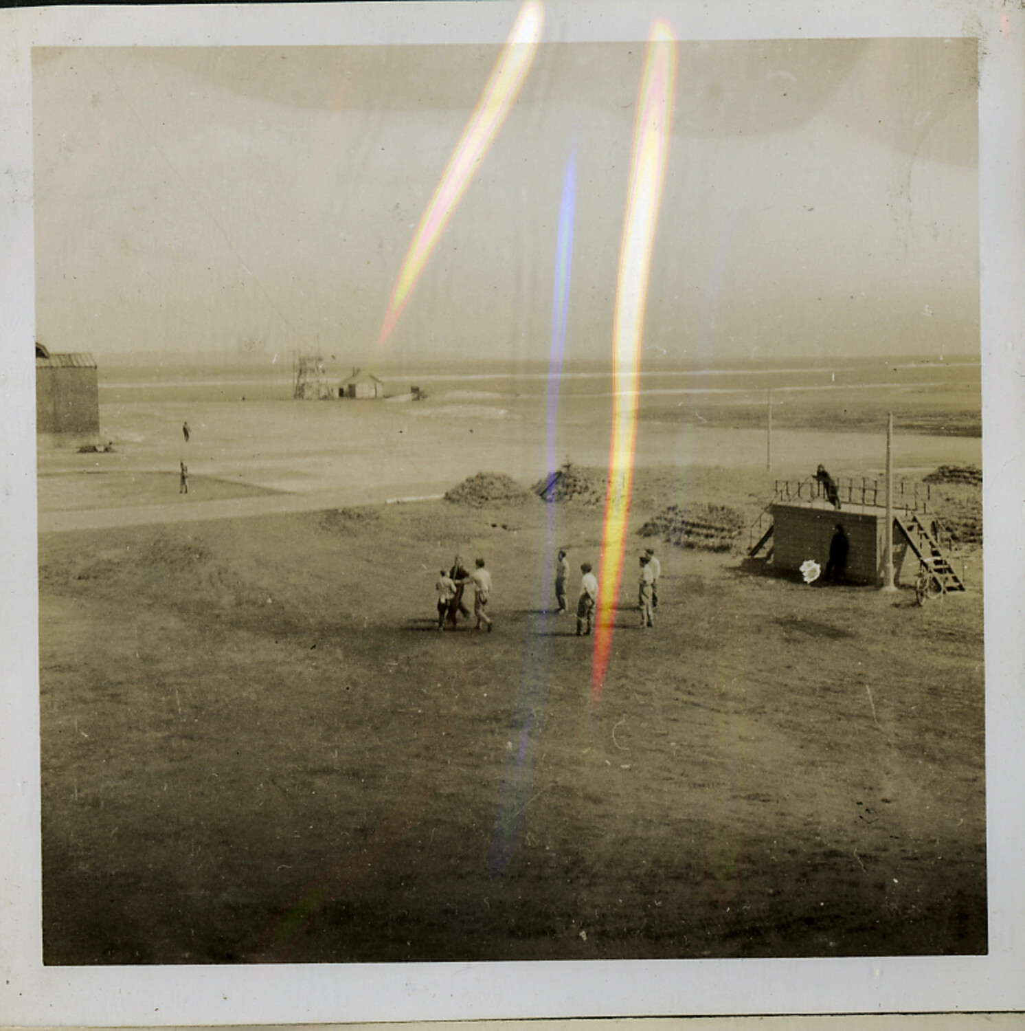 Servicemen at Coastal Installation with Observation Platform