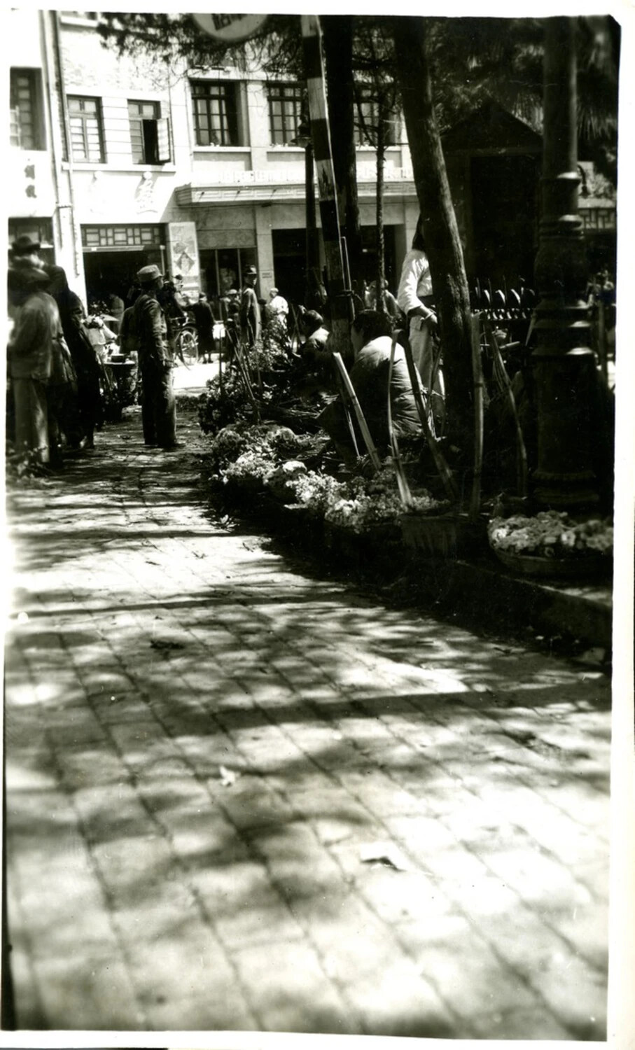 Street Vendors and Pedestrians on a Shaded City Sidewalk, Wartime China
