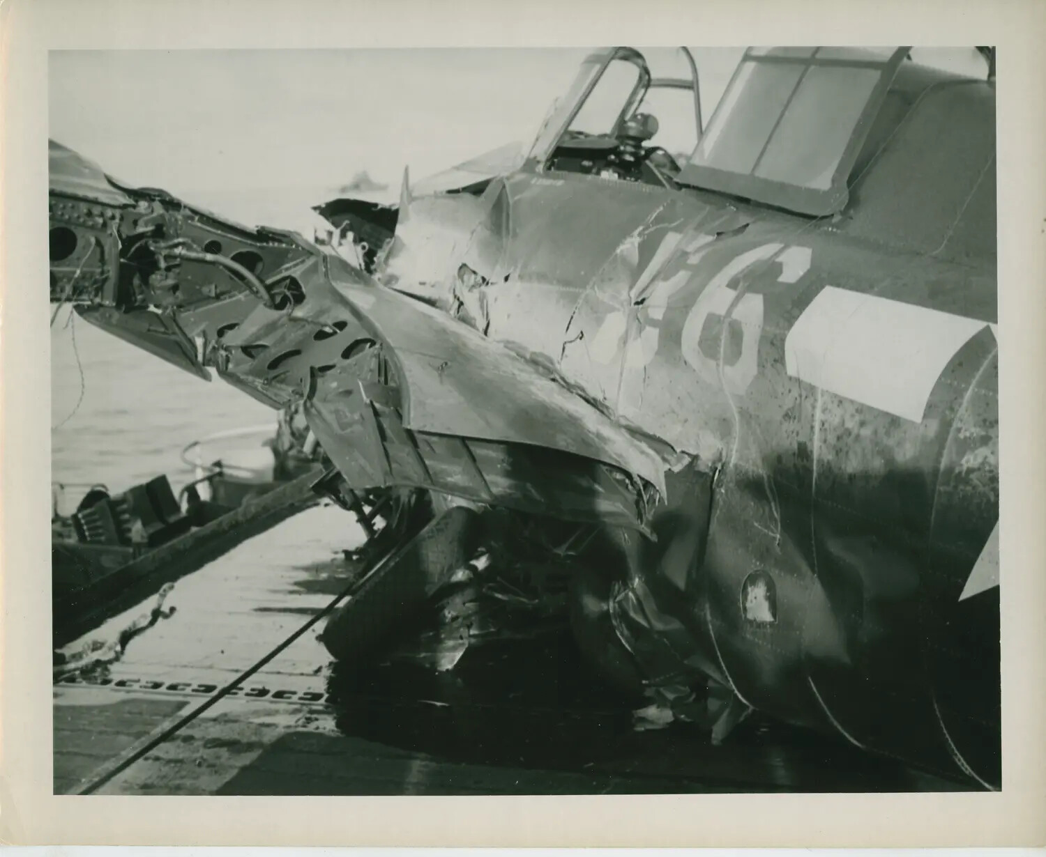 Crash-Damaged Carrier Fighter Aircraft Aboard USS Petrof Bay (CVE-80)