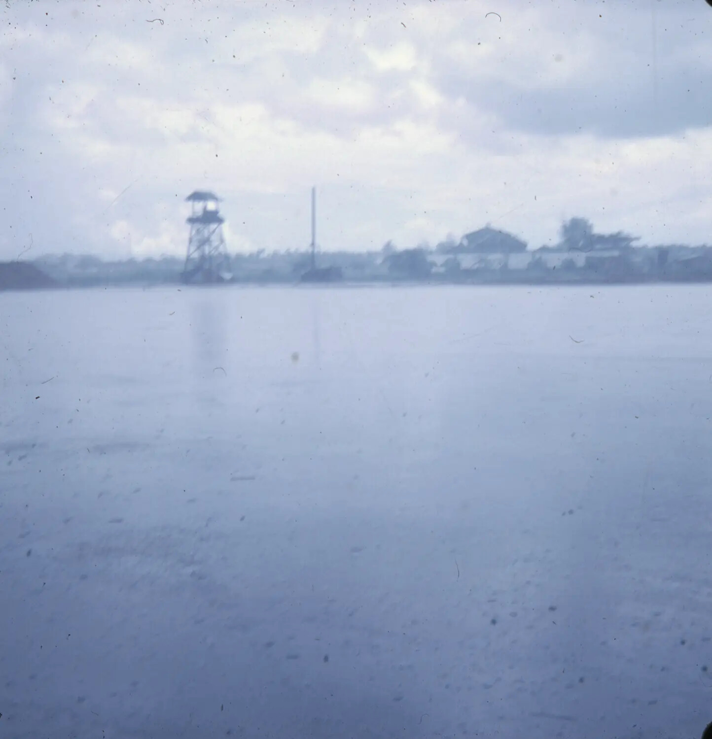 Vietnam War Era 35mm Slide: Distant View of Guard Tower and Waterfront Installation, S. Sac Collection
