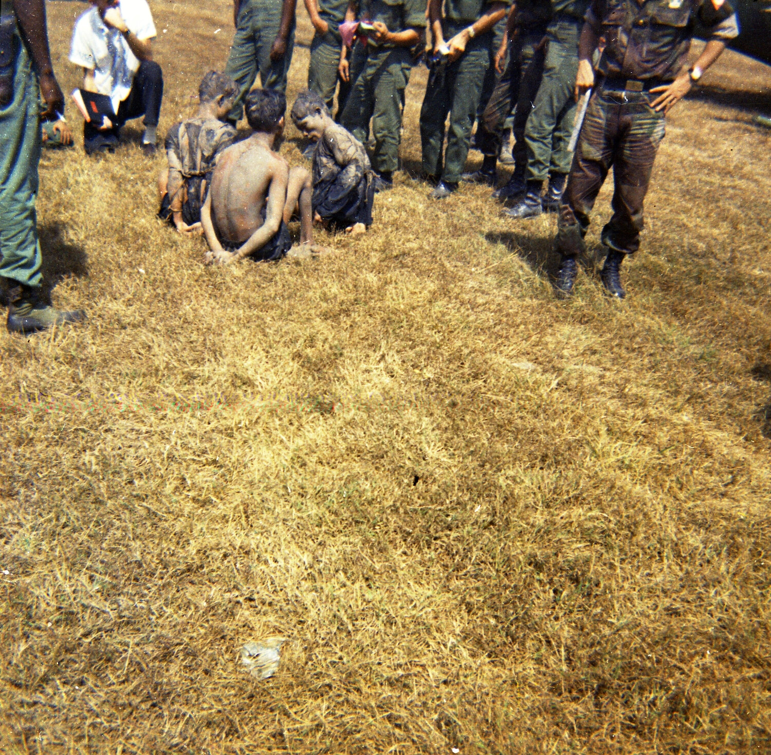 Close View of Detainees Surrounded by Military Personnel, South Vietnam, 1963
