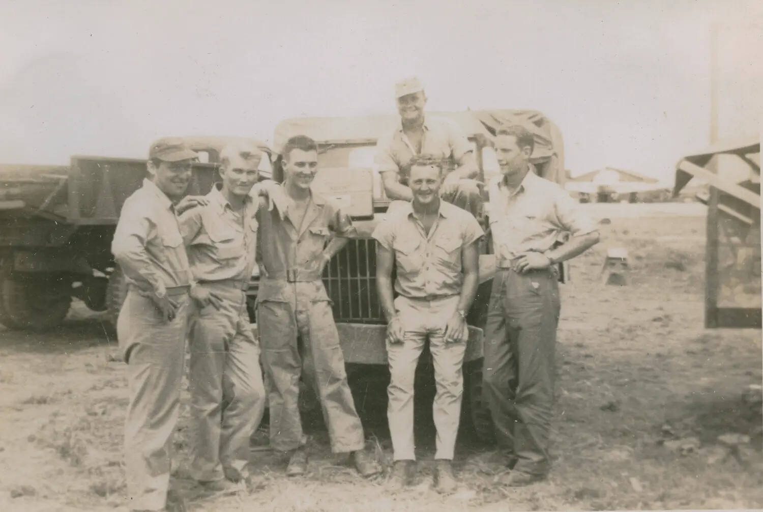 Edward P. McAleer and Comrades Beside a Military Truck