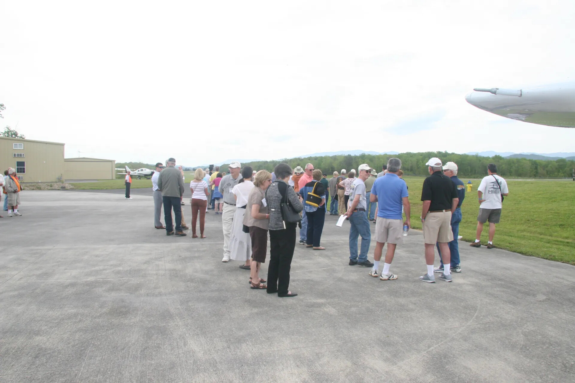 Attendees Mingle on Airport Ramp Near Parked Aircraft, Operation Tailwind Commemorative Event, 2016