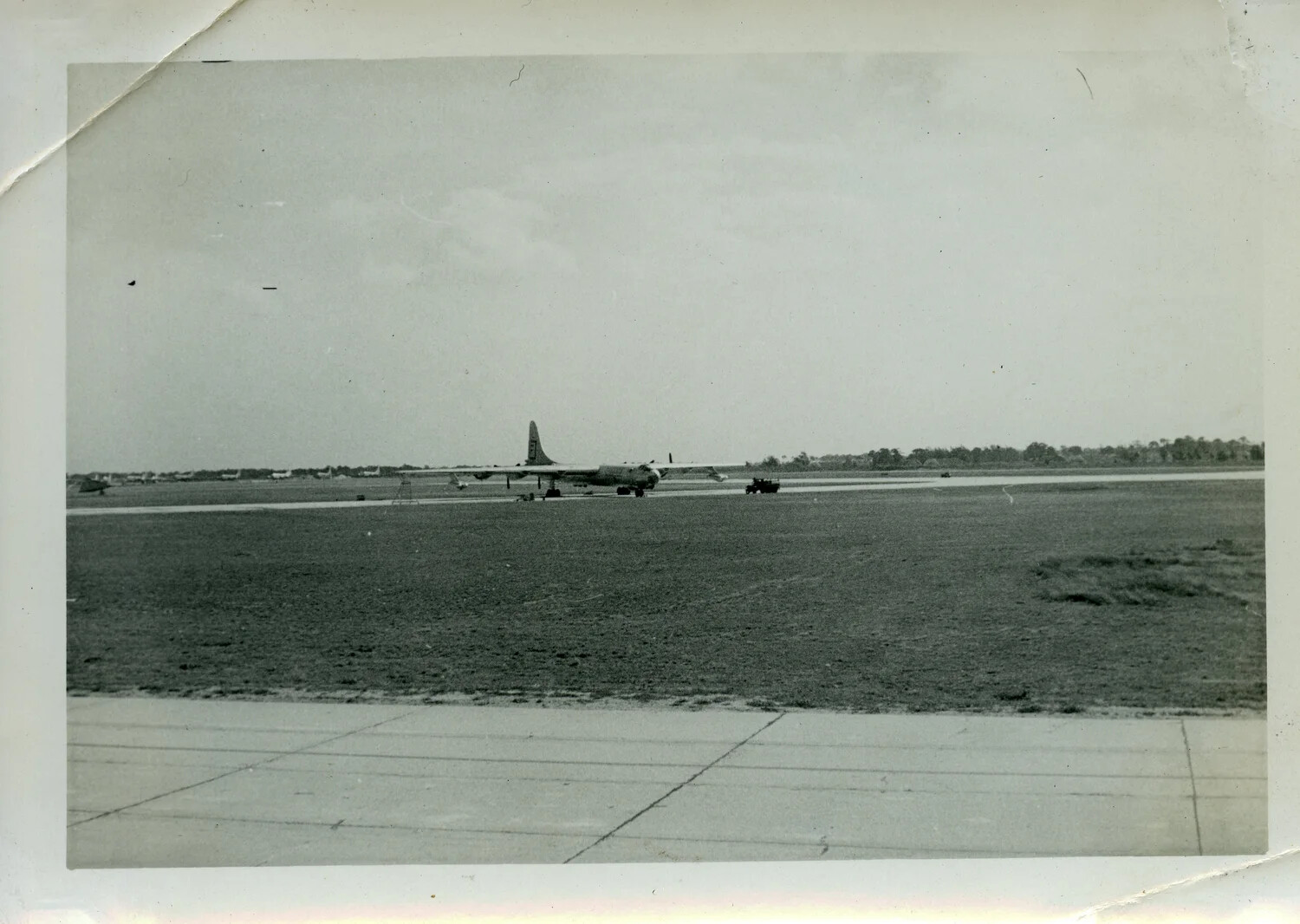 Four-Engine Military Bomber on Airfield Apron, Possibly Hickam Field, Hawaii