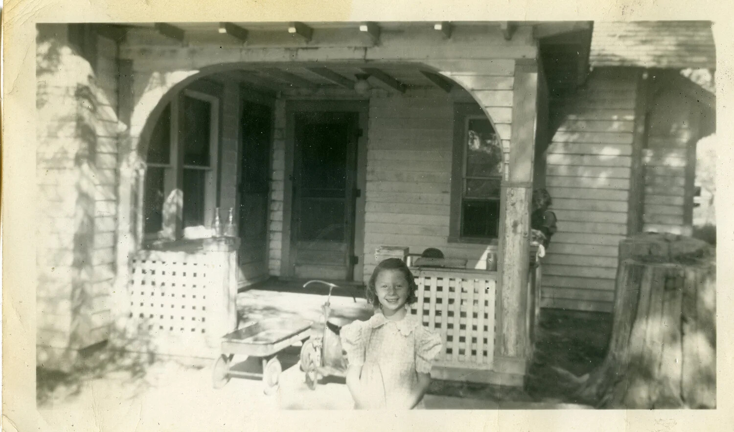 Family Snapshot: Young Girl on Porch of American Bungalow, WWII Home Front