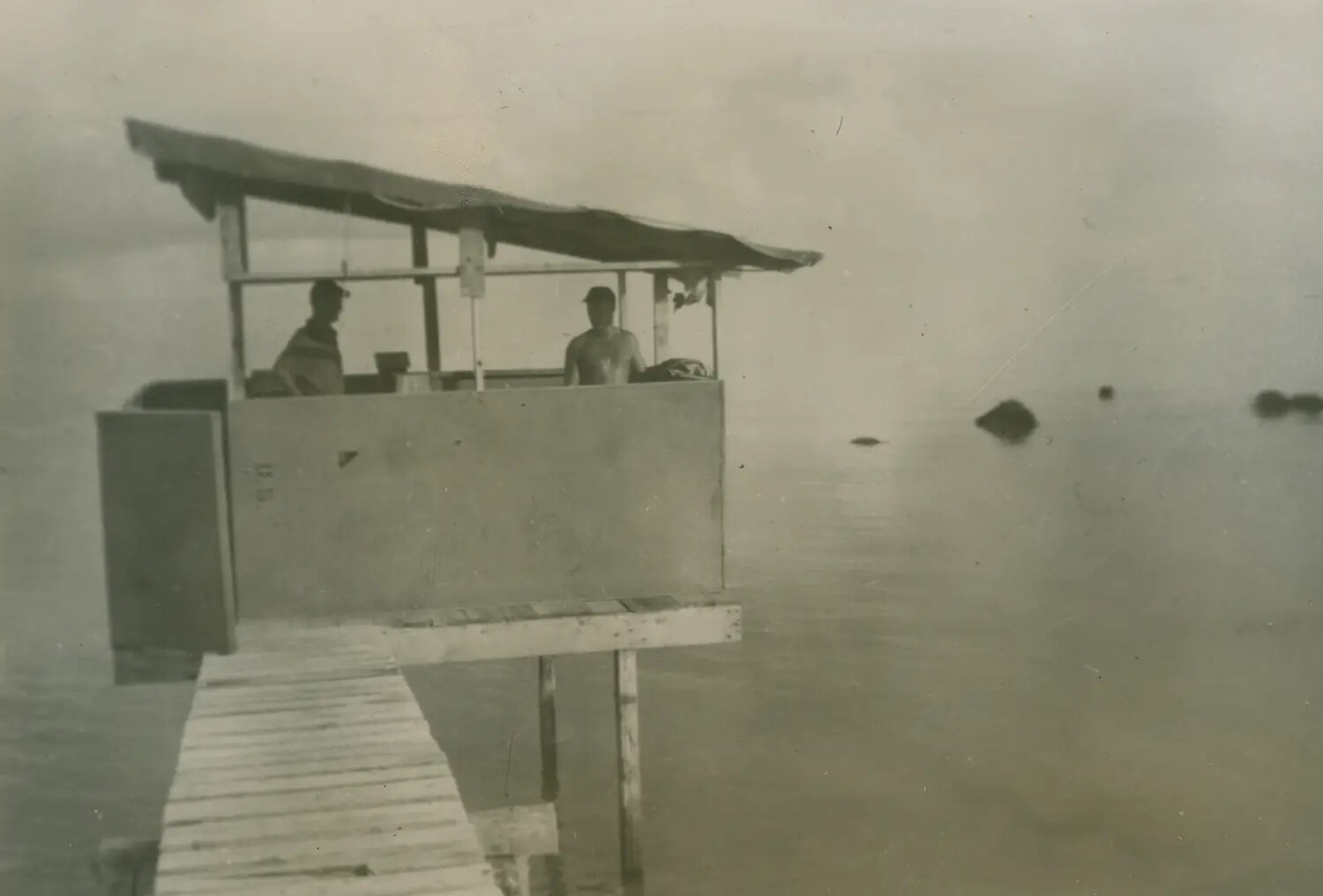 Two Men on Covered Dock Platform Over Water, McAleer Album