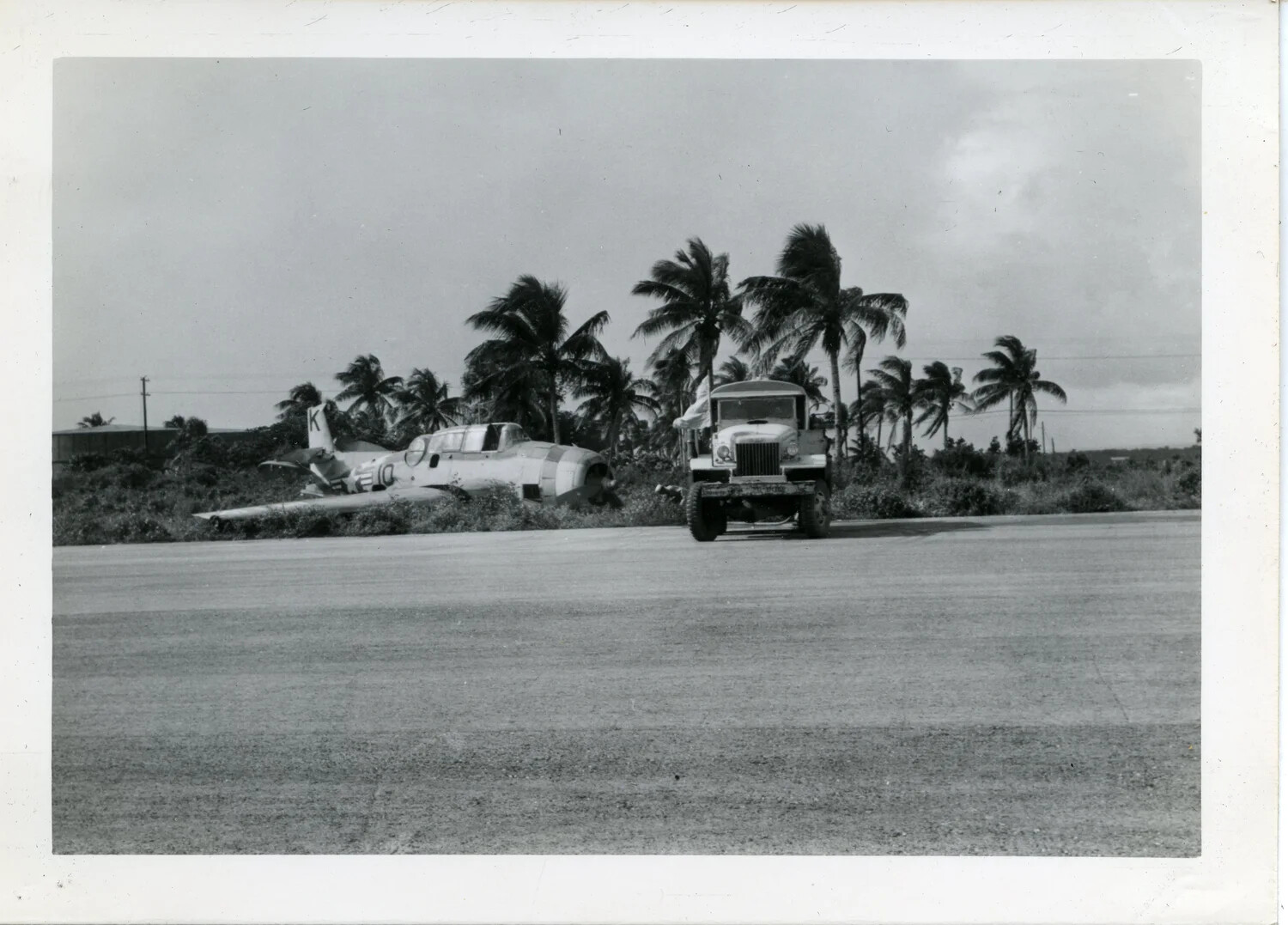 Wrecked Japanese Aircraft Beside Airfield Runway, Pacific Theater, World War II