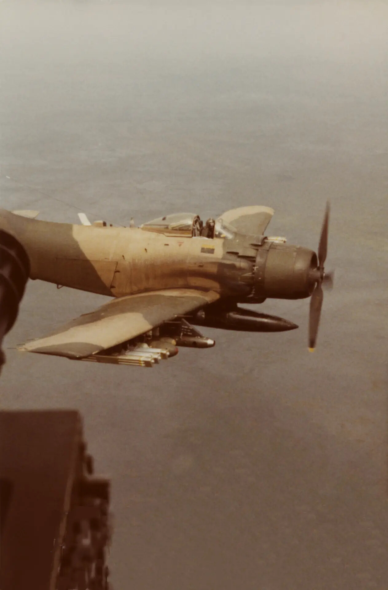 A-1 Skyraider in Flight with Underwing Ordnance, Overwater Transit, Vietnam War