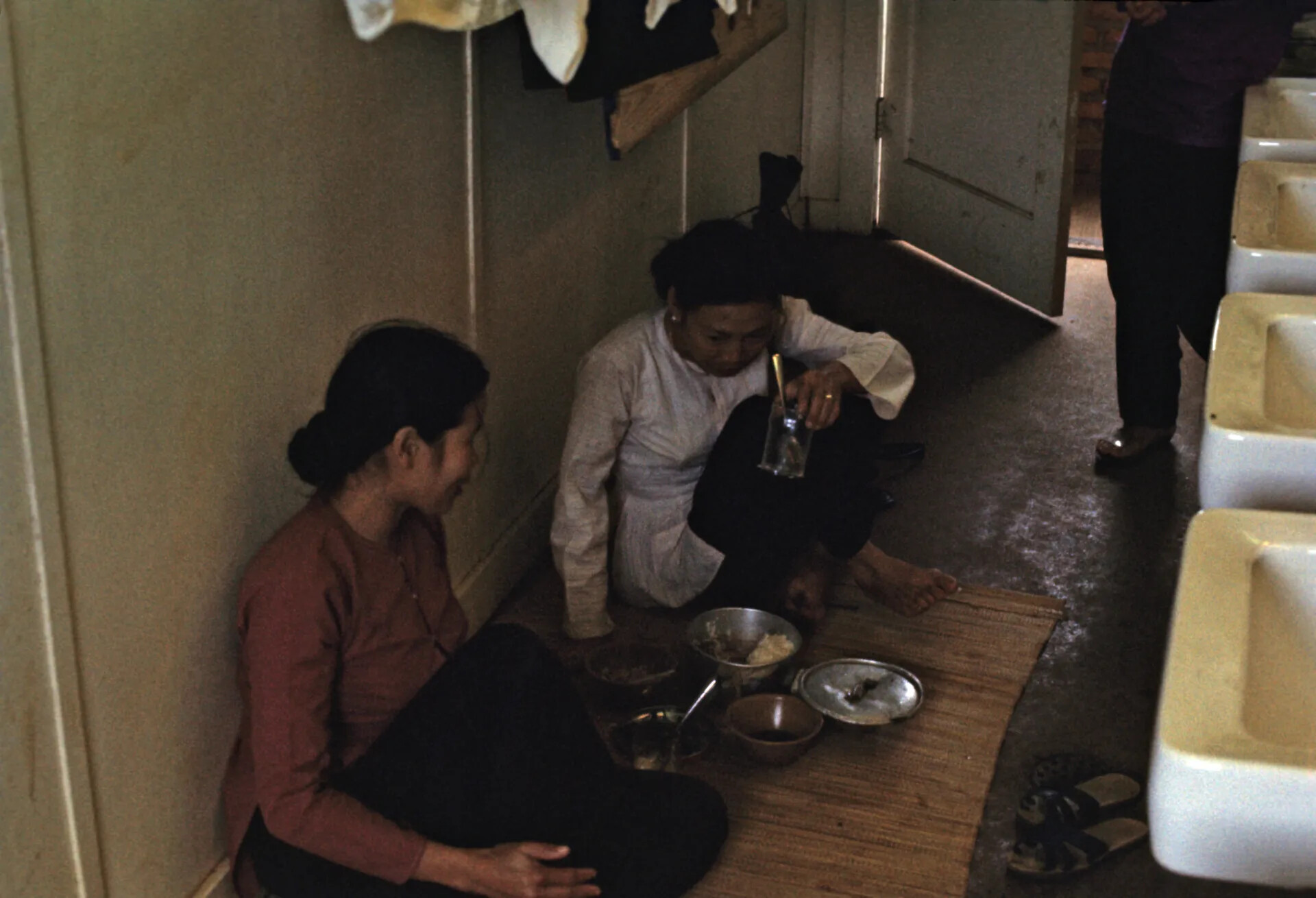 Vietnamese Domestic Staff Sharing a Meal, Barracks Interior, Vietnam War Era