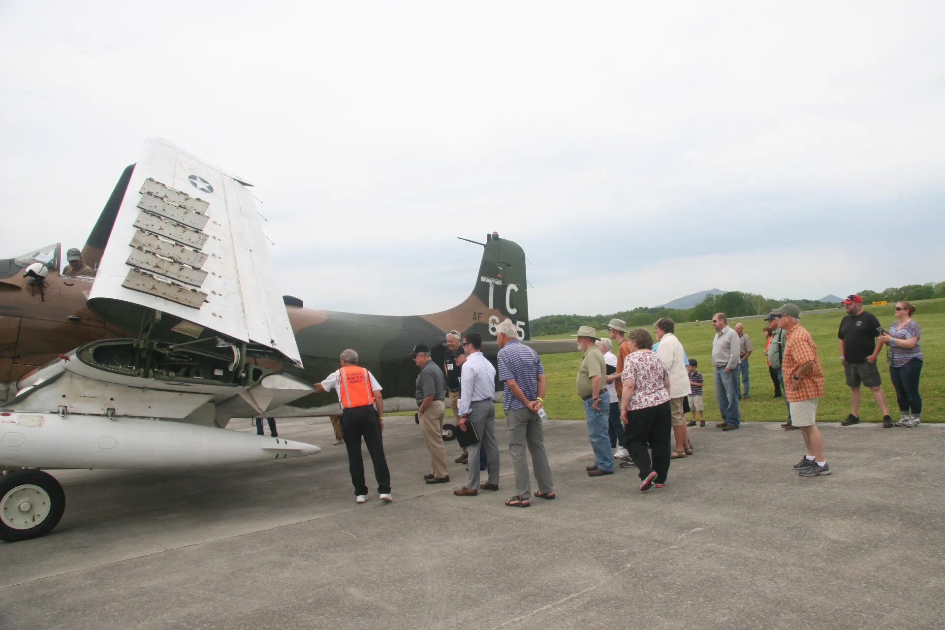 Visitors Examine A-1 Skyraider at Operation Tailwind Event, 2016