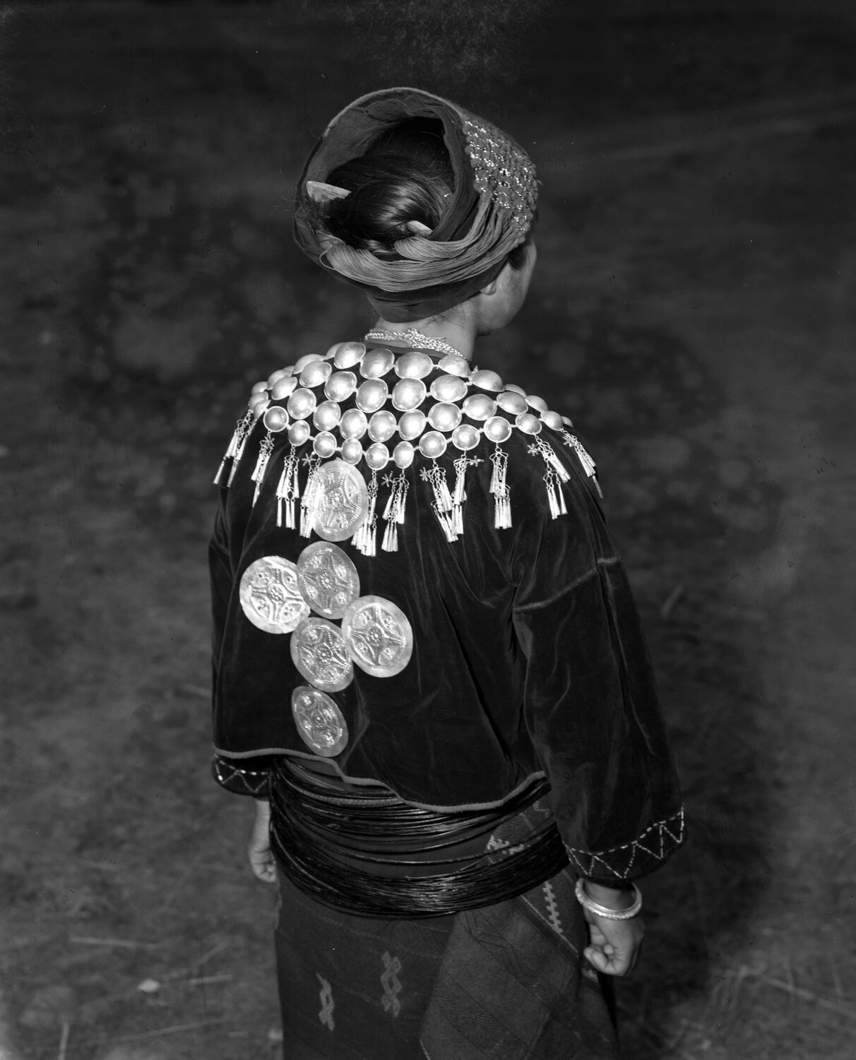 Rear View of Burmese Hill Tribe Woman in Traditional Silver-Adorned Dress, WWII Era