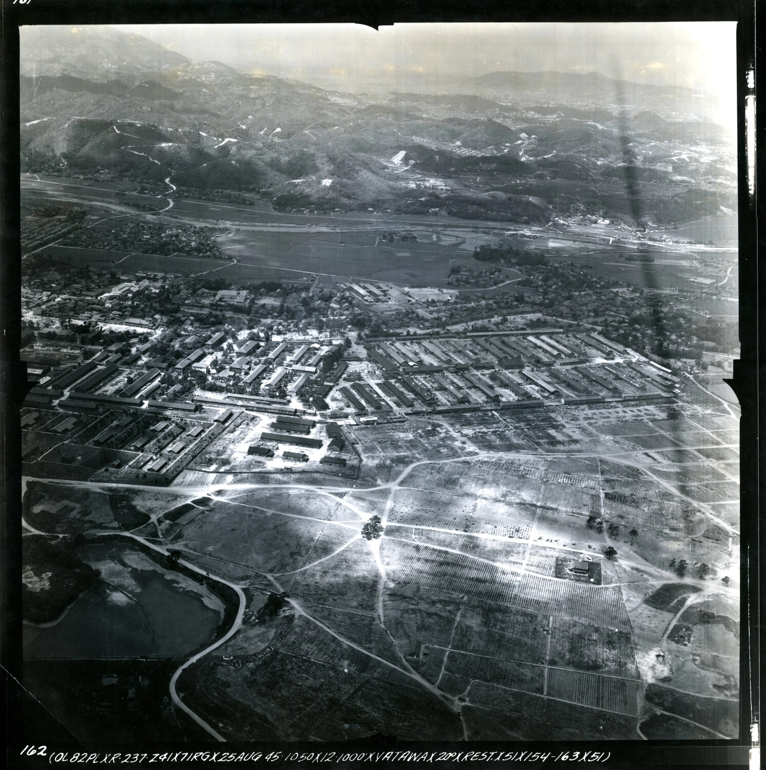 Aerial Reconnaissance Photograph of Japanese Town/Installation, Dated 25 August 1945