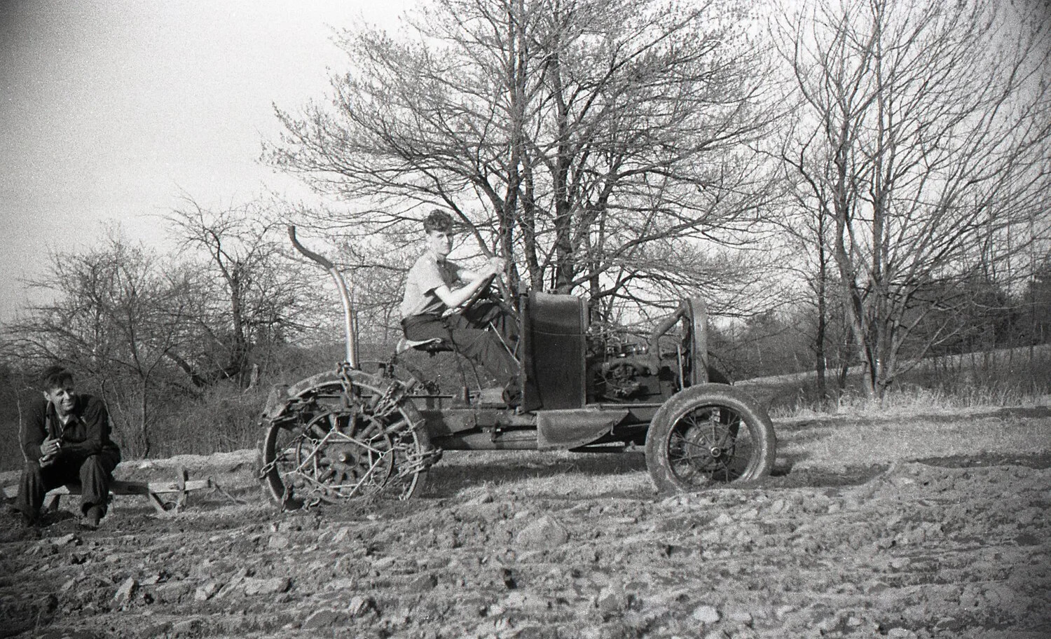 Farmer Taking a Break Beside Tractor and Plow, New England Farm