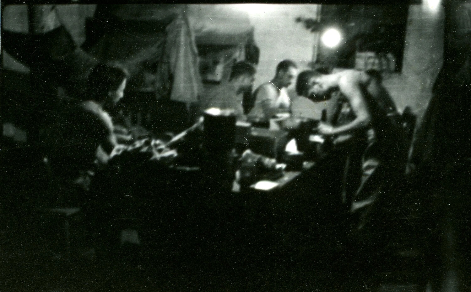 Servicemen Gathered Around a Table at Night, Burma/CBI Theater Collection