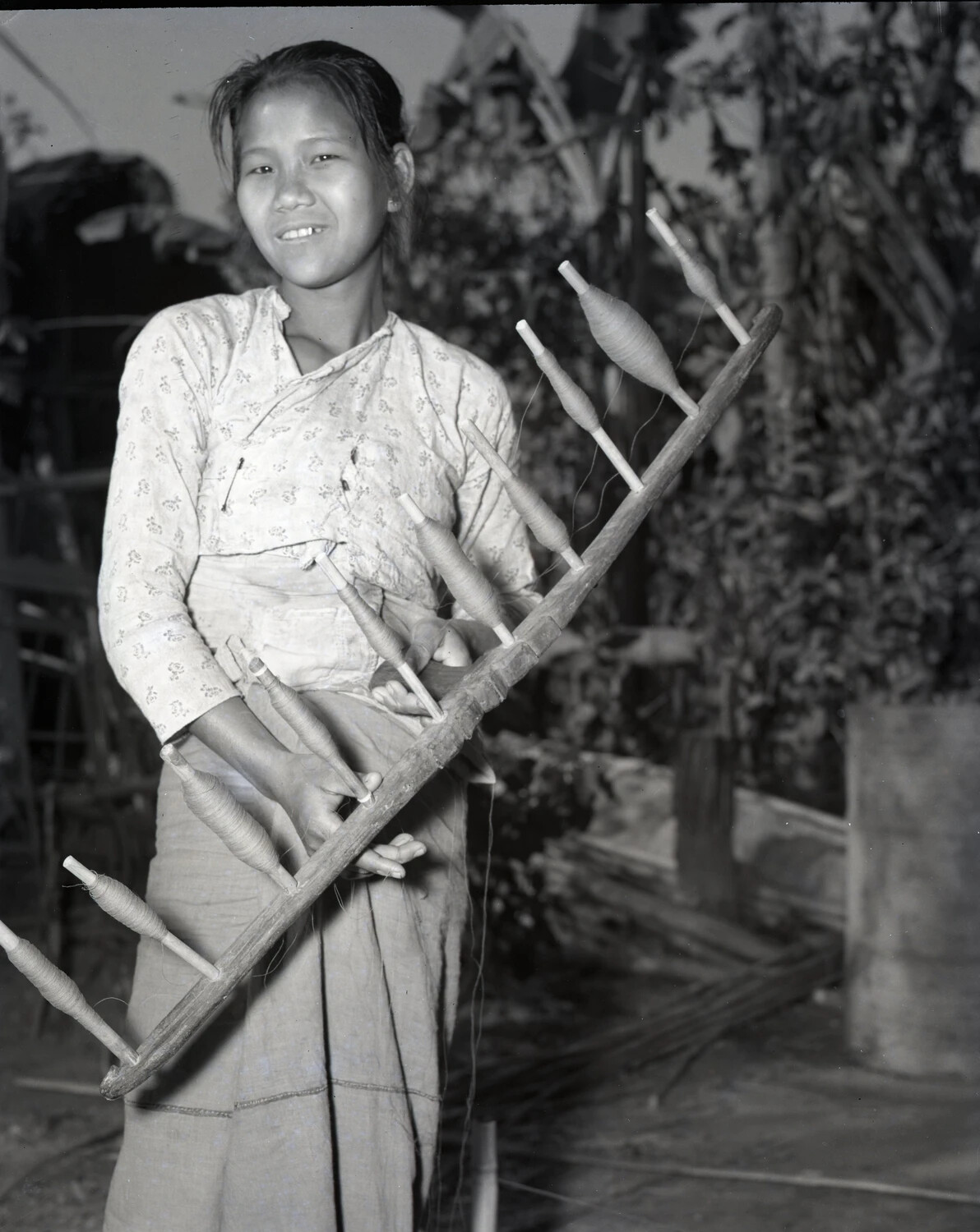 Young Burmese Woman with Traditional Thread-Winding Frame, WWII China-Burma-India Theater