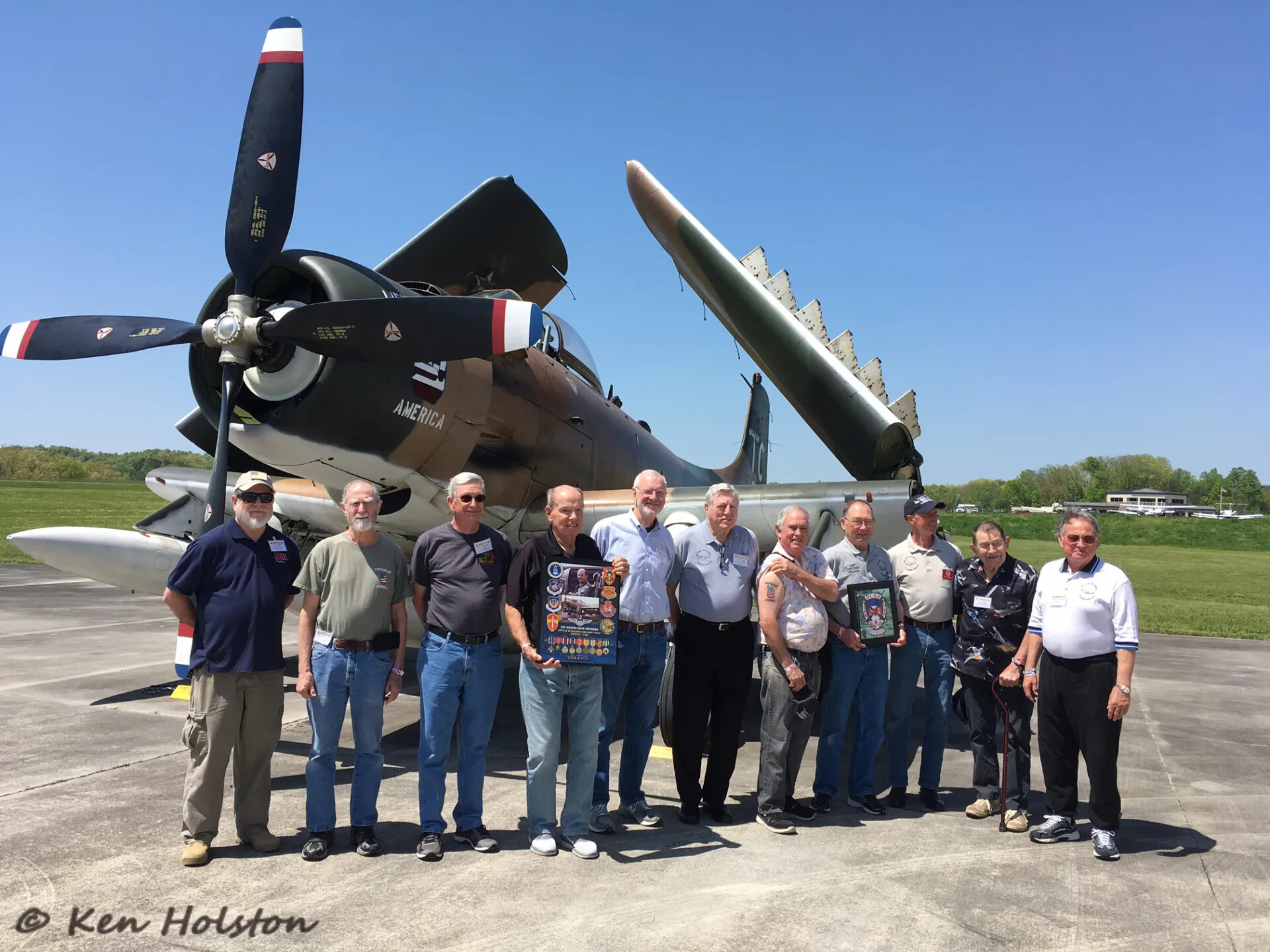Veterans Group Portrait with A-1 Skyraider 'America,' Tailwind Reunion Event