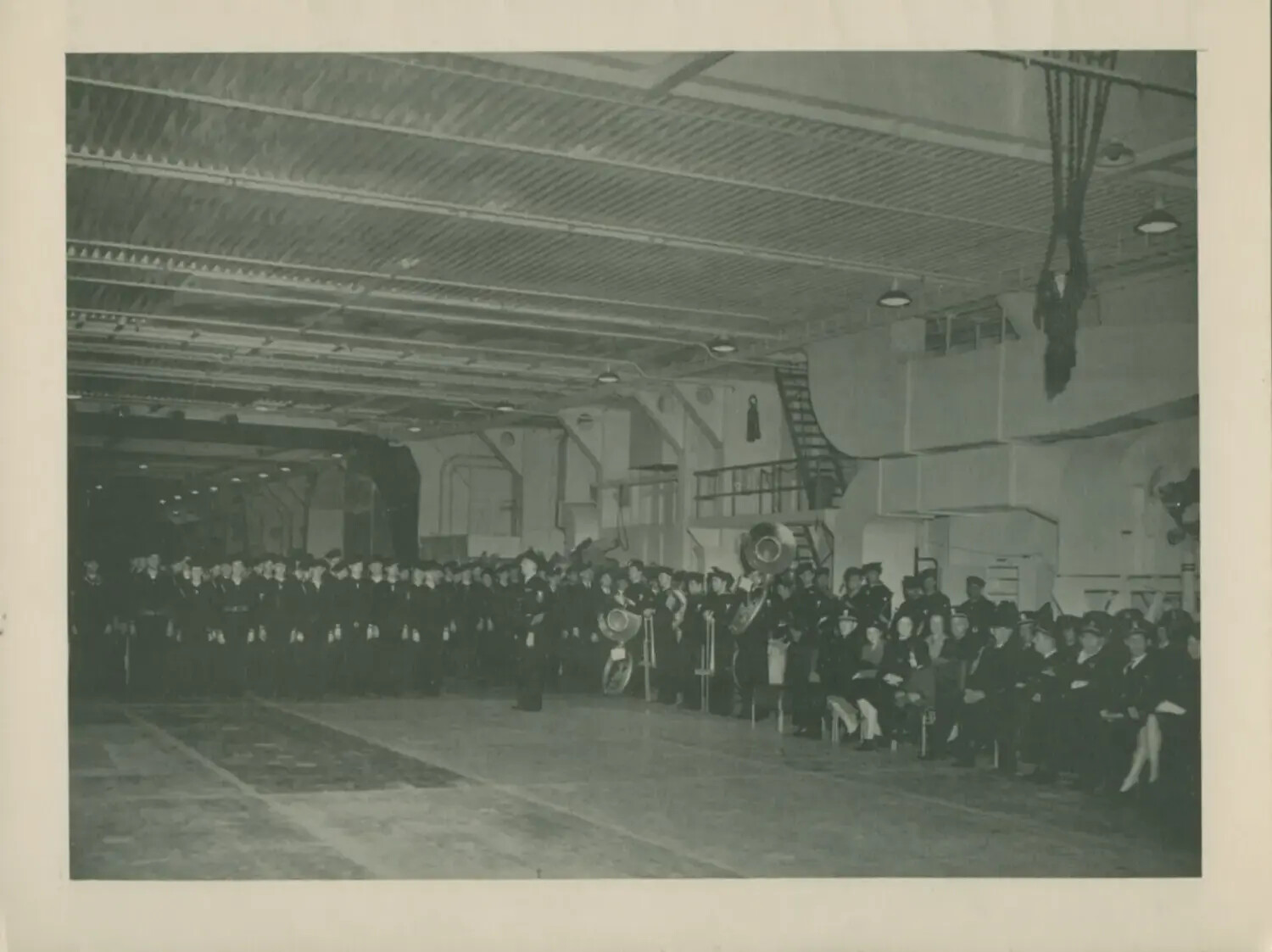 Formal Ceremony on Hangar Deck with Ship's Band, USS Petrof Bay (CVE-80)