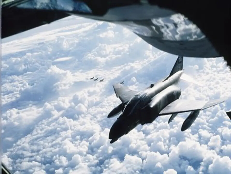 F-4 Phantom II Approaching KC-135 Tanker with Formation Aircraft in Distance