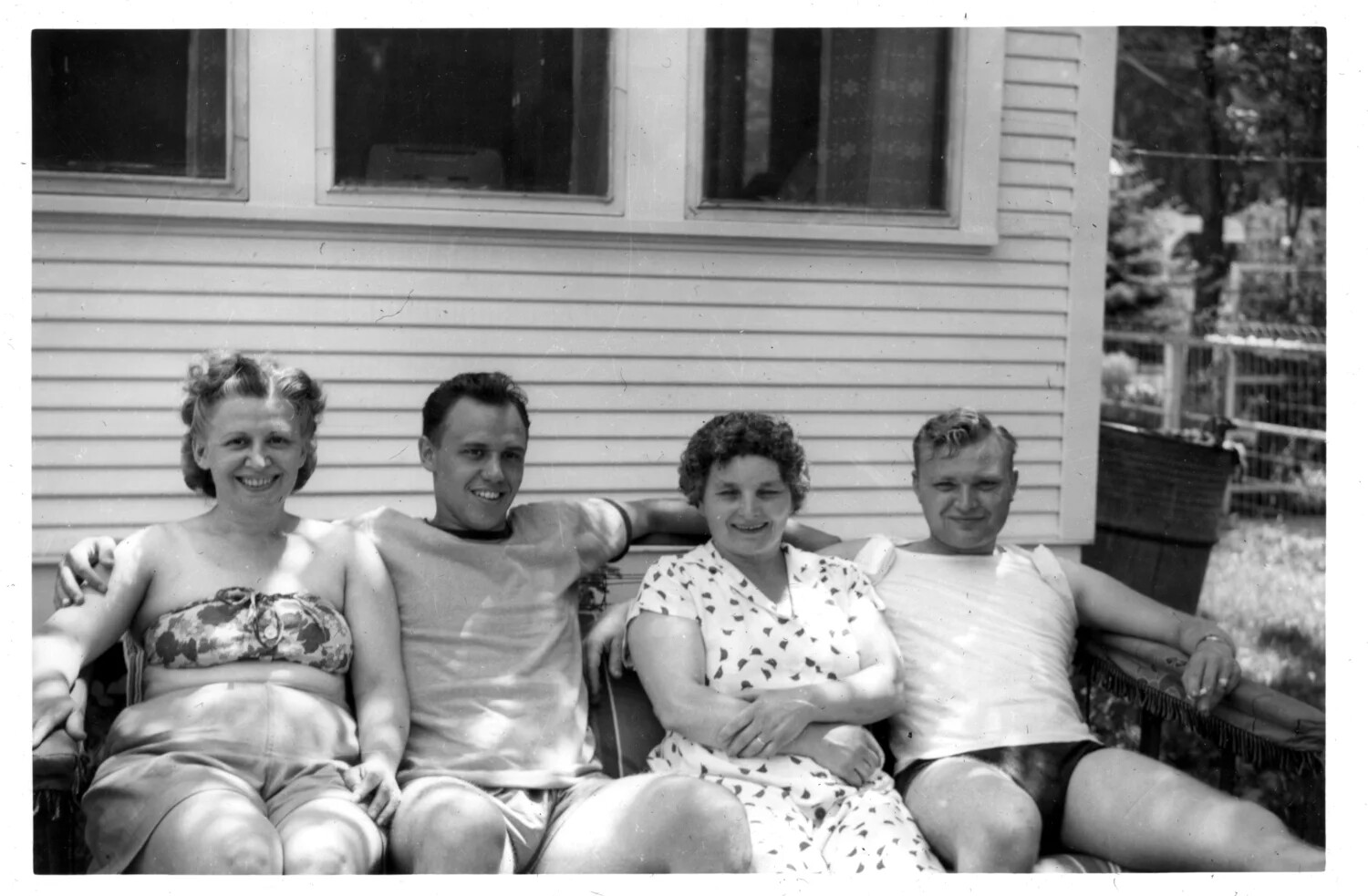 Group Portrait of Two Women and Two Men on a Porch Glider, Early 1950s