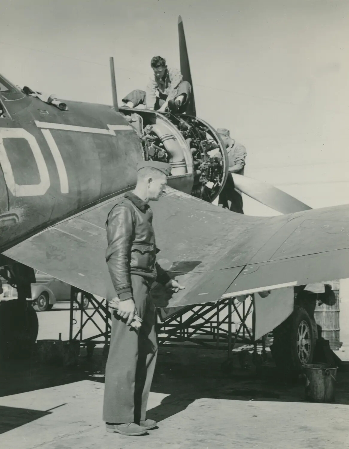 Ground Crew Servicing Radial Engine on Folded-Wing Marine Corsair Fighter, McAleer Collection, WWII