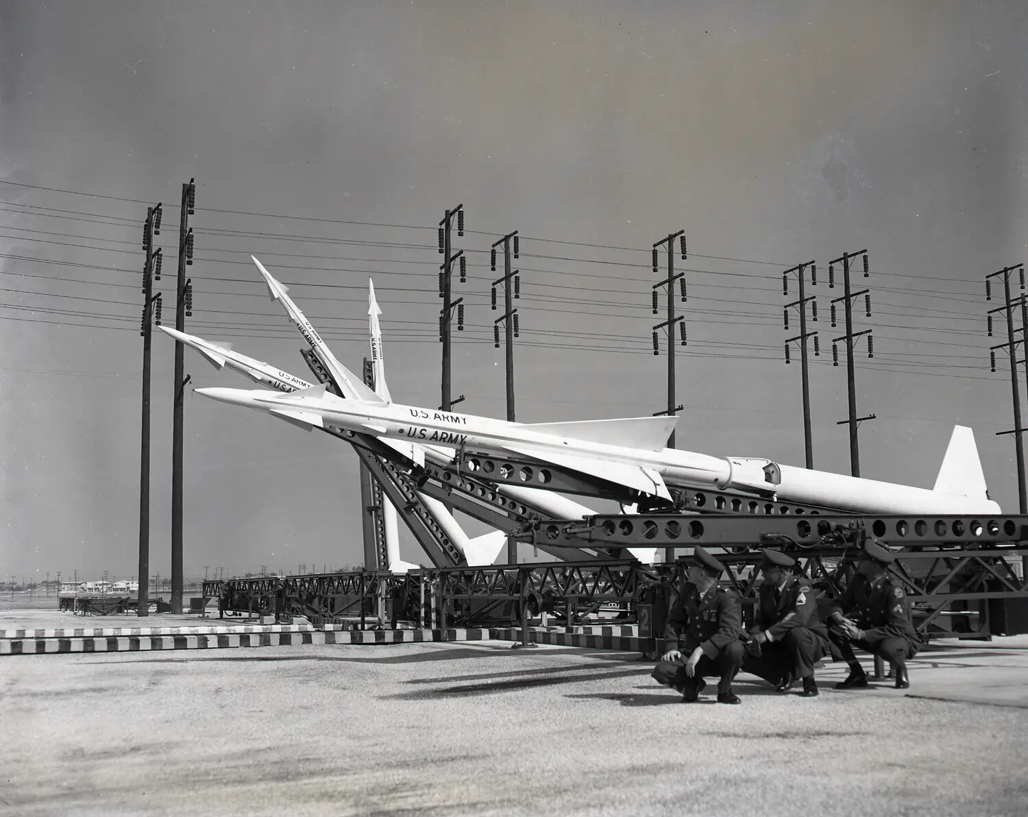 Nike Ajax Surface-to-Air Missiles on Erector-Launcher Rail, U.S. Army Air Defense Battery