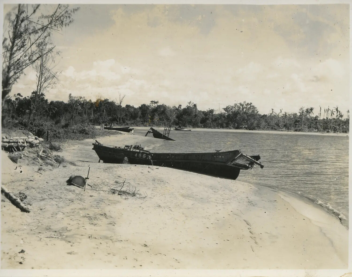 Beached Landing Craft Along Tropical Shoreline, 312th Bomb Group Area of Operations