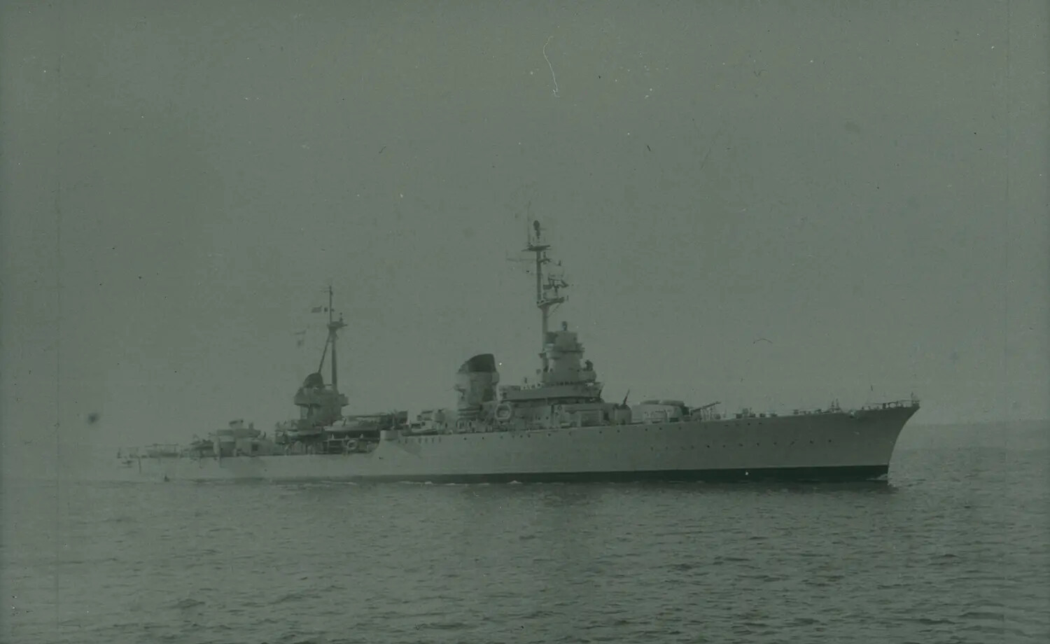 U.S. Navy Cruiser Underway at Sea, World War II Era