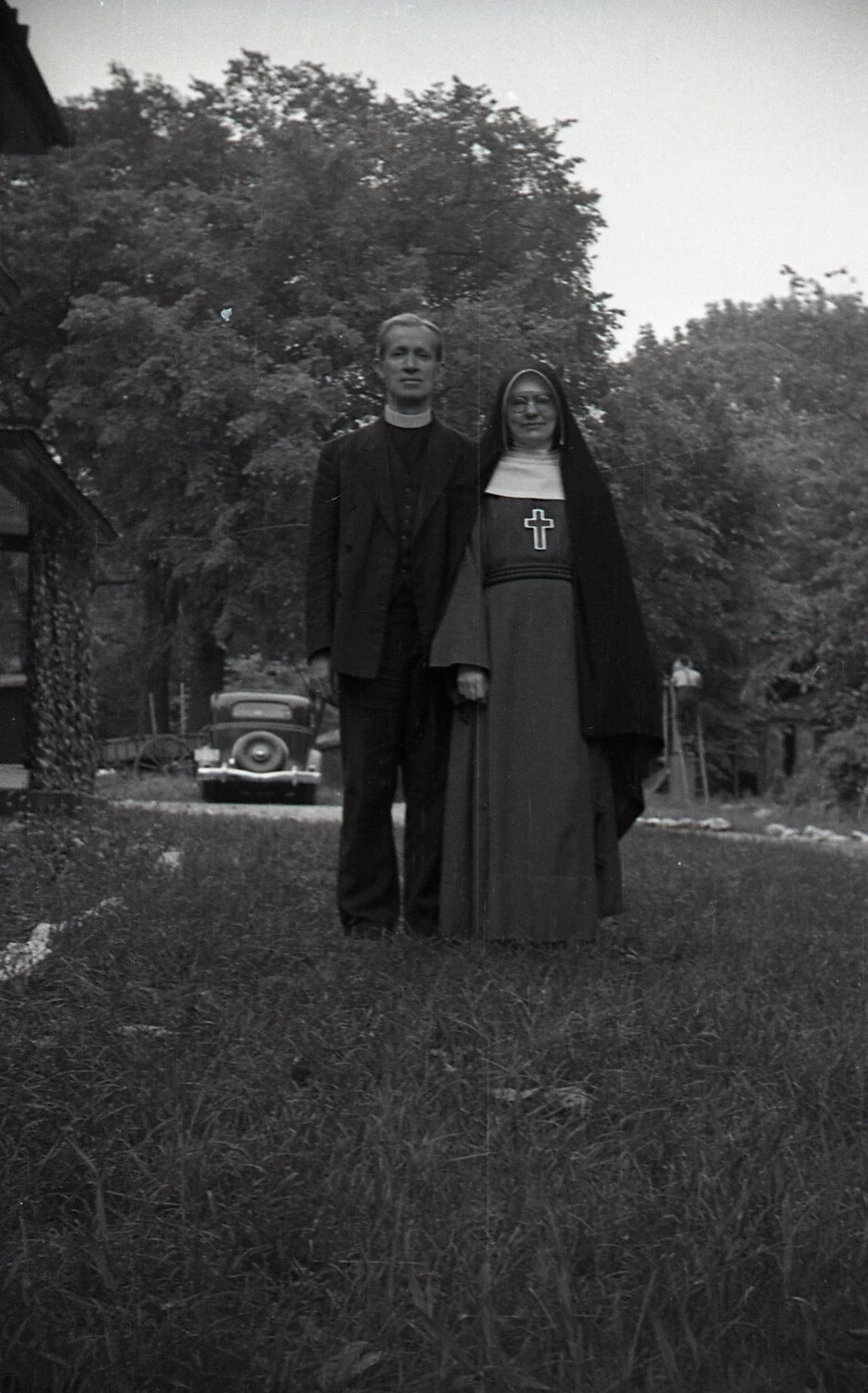 Catholic Priest and Nun Portrait with Vintage Automobile, c. 1940s