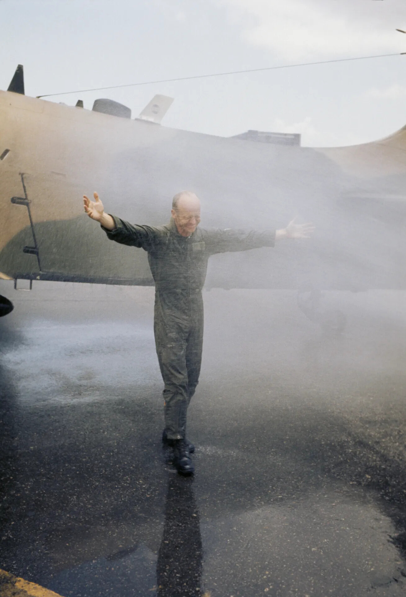Airman Embracing Water Spray During Wetting-Down Celebration, Vietnam War Era