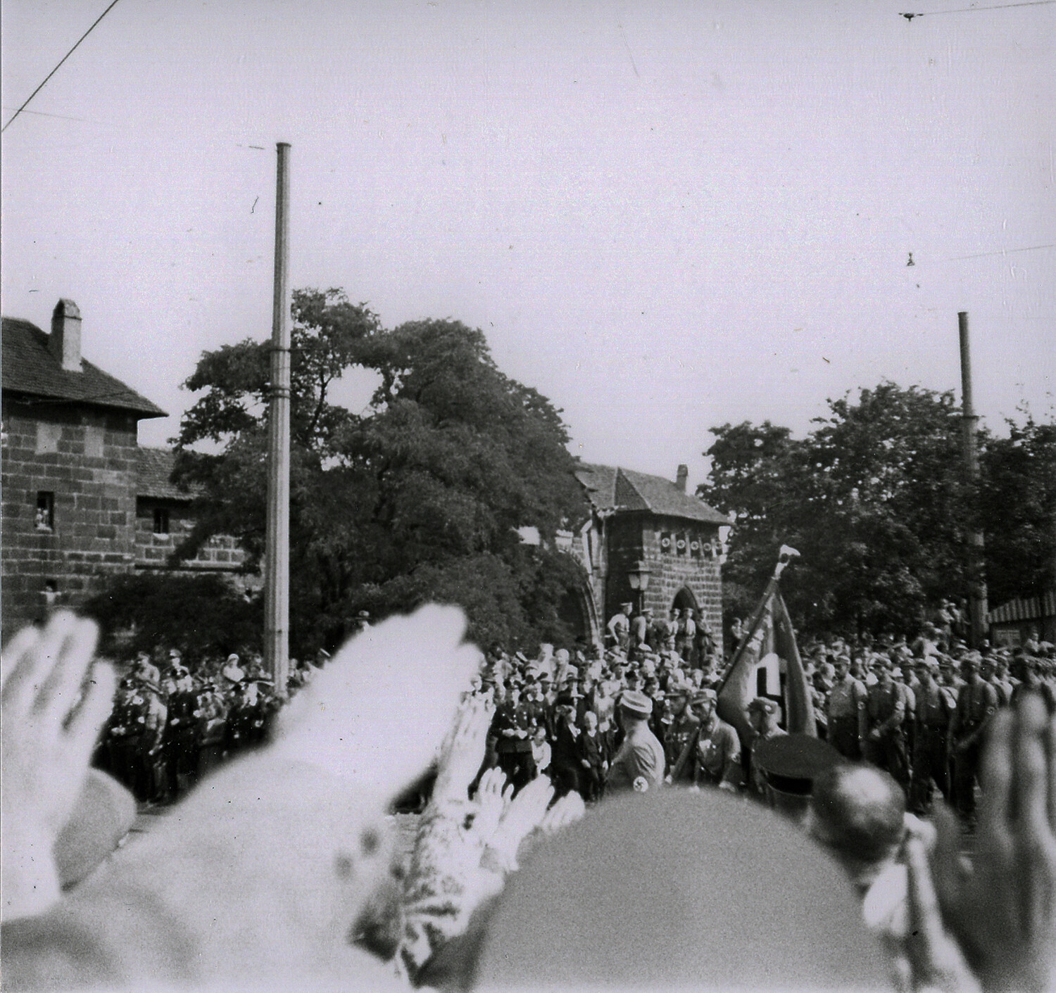 Crowd Rendering Nazi Salute as Uniformed Column Marches Through Historic Gate, Nuremberg, Germany