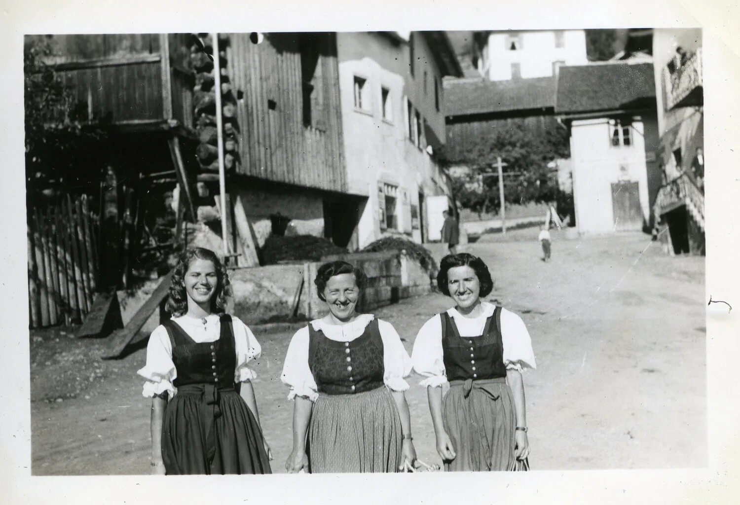 Three Women in Traditional Alpine Dress, European Village Street, WWII Era (44th Infantry Division Collection)
