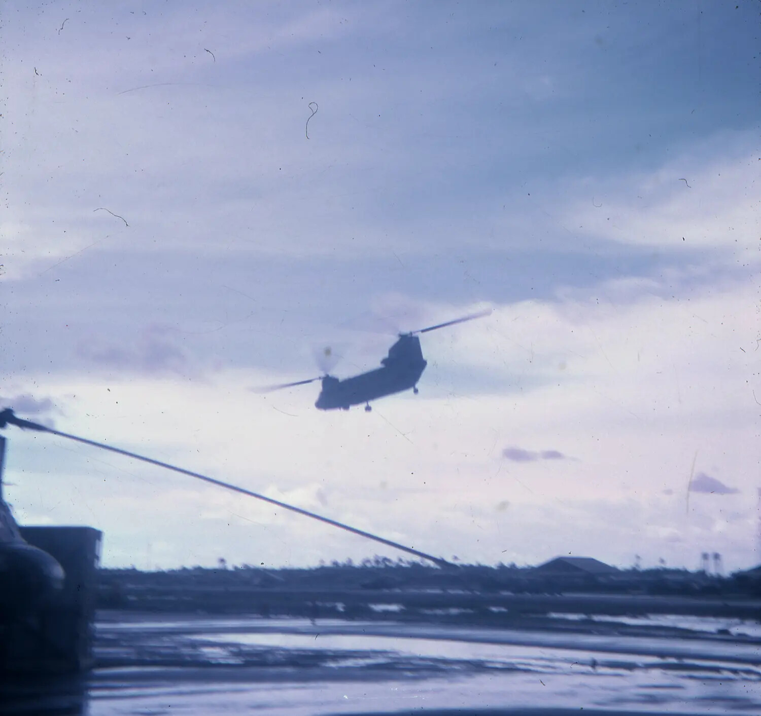 CH-47 Chinook Helicopter in Flight Over Vietnam Airfield