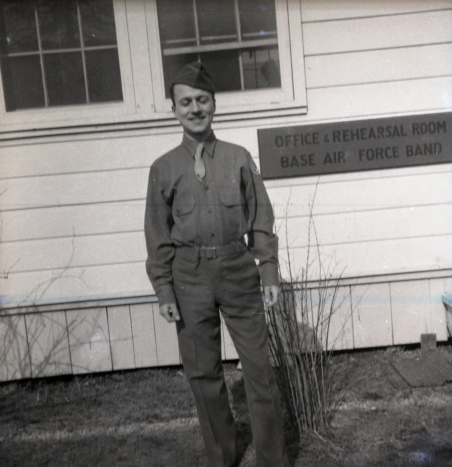 Airman Posed Before the Base Air Force Band Office and Rehearsal Room