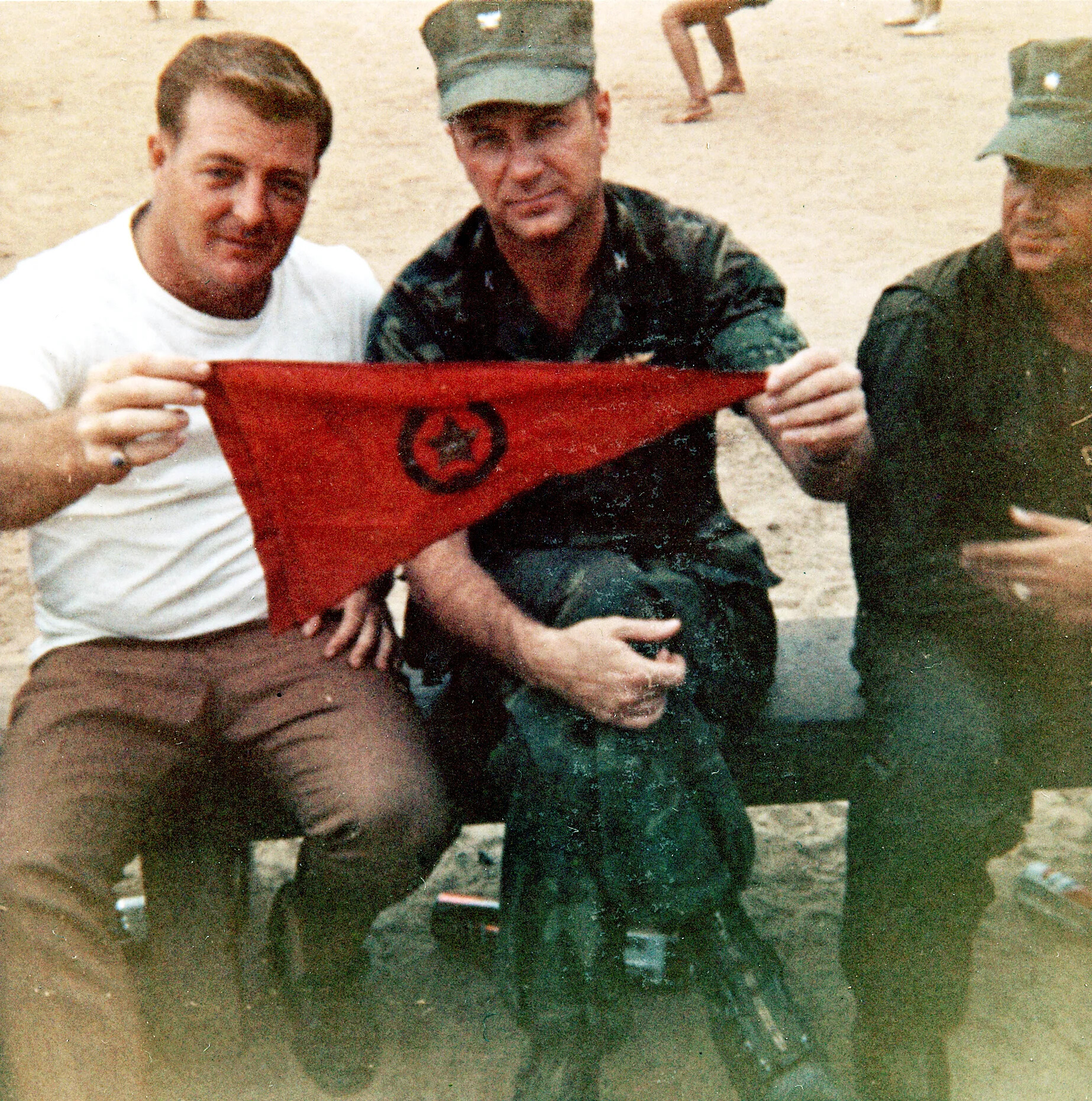 Two Servicemen Display Captured Red Star Pennant, Gene McCarley Collection (Operation Tailwind Materials)