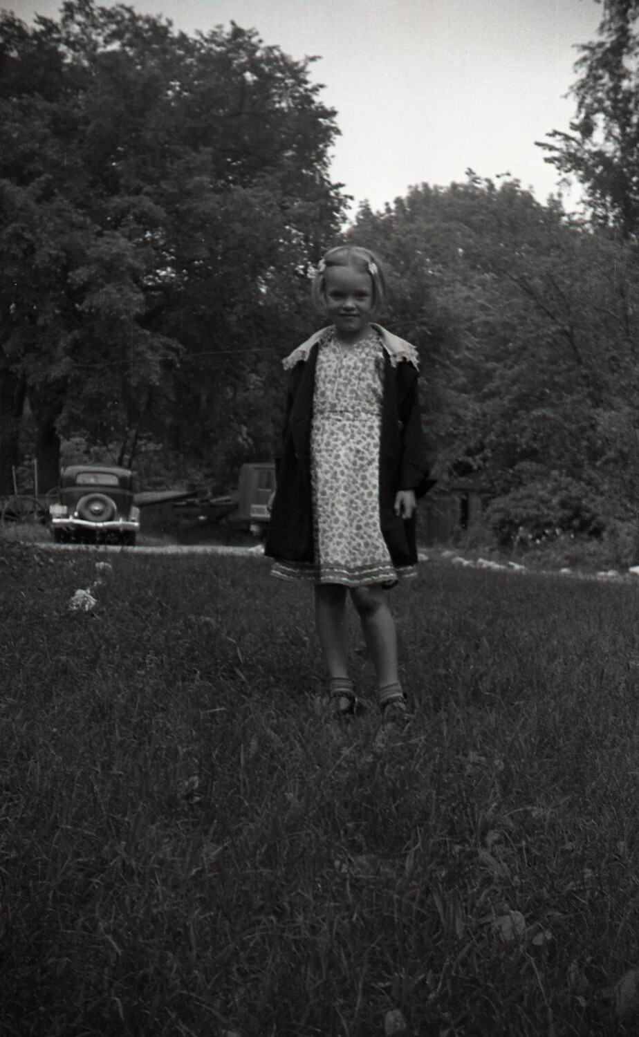 Girl in Floral Dress Standing in Field, Mid-20th Century