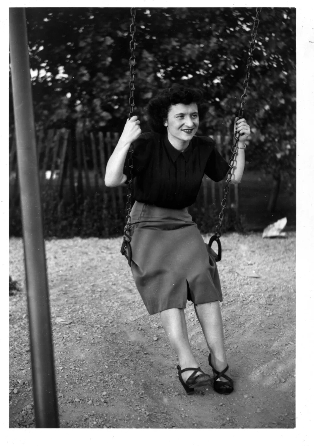 Personal Snapshot: Young Woman on a Playground Swing, c. Late 1940s