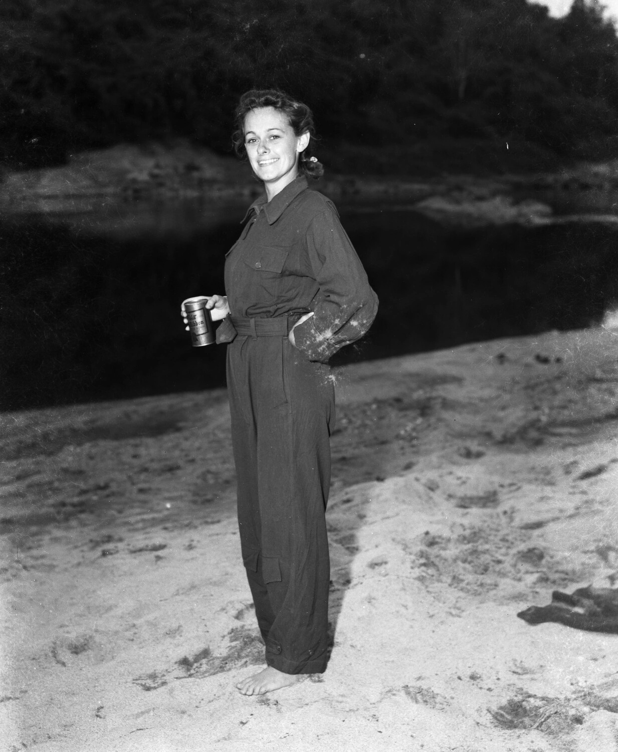 Woman in Coveralls on Riverbank, Burma Theater, WWII (Kotec CBI Collection)