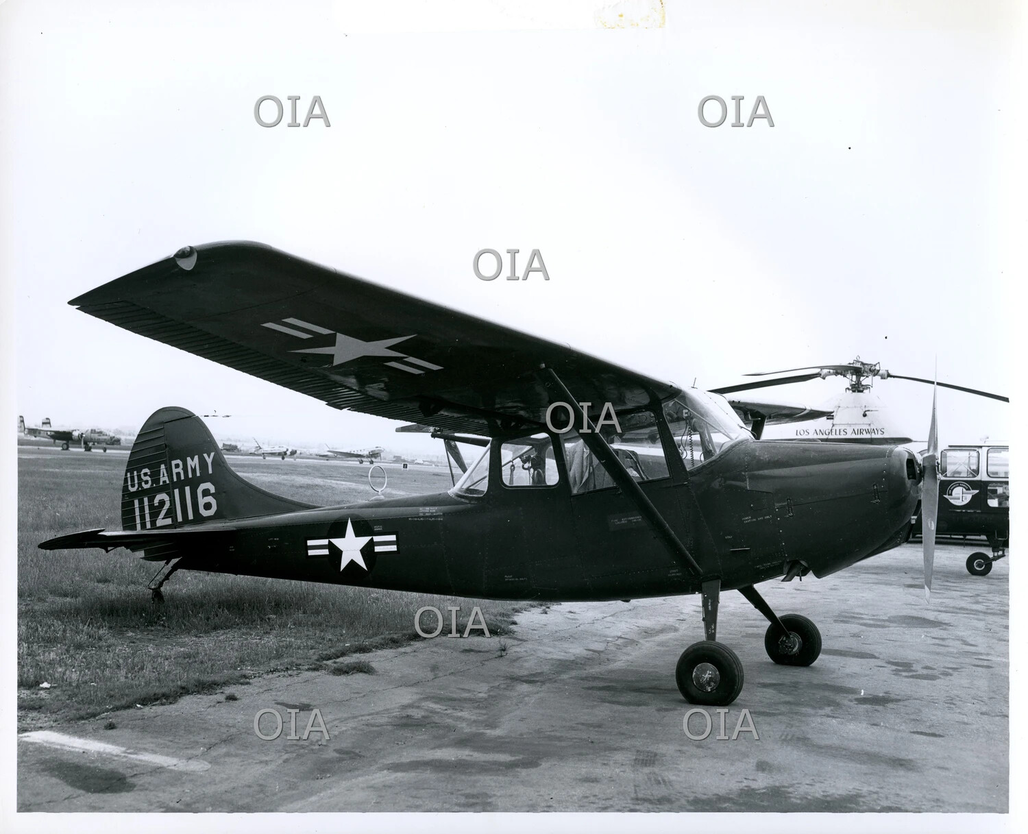 U.S. Army Cessna L-19 "Bird Dog" Liaison Aircraft, Serial 112116, on Airfield Ramp