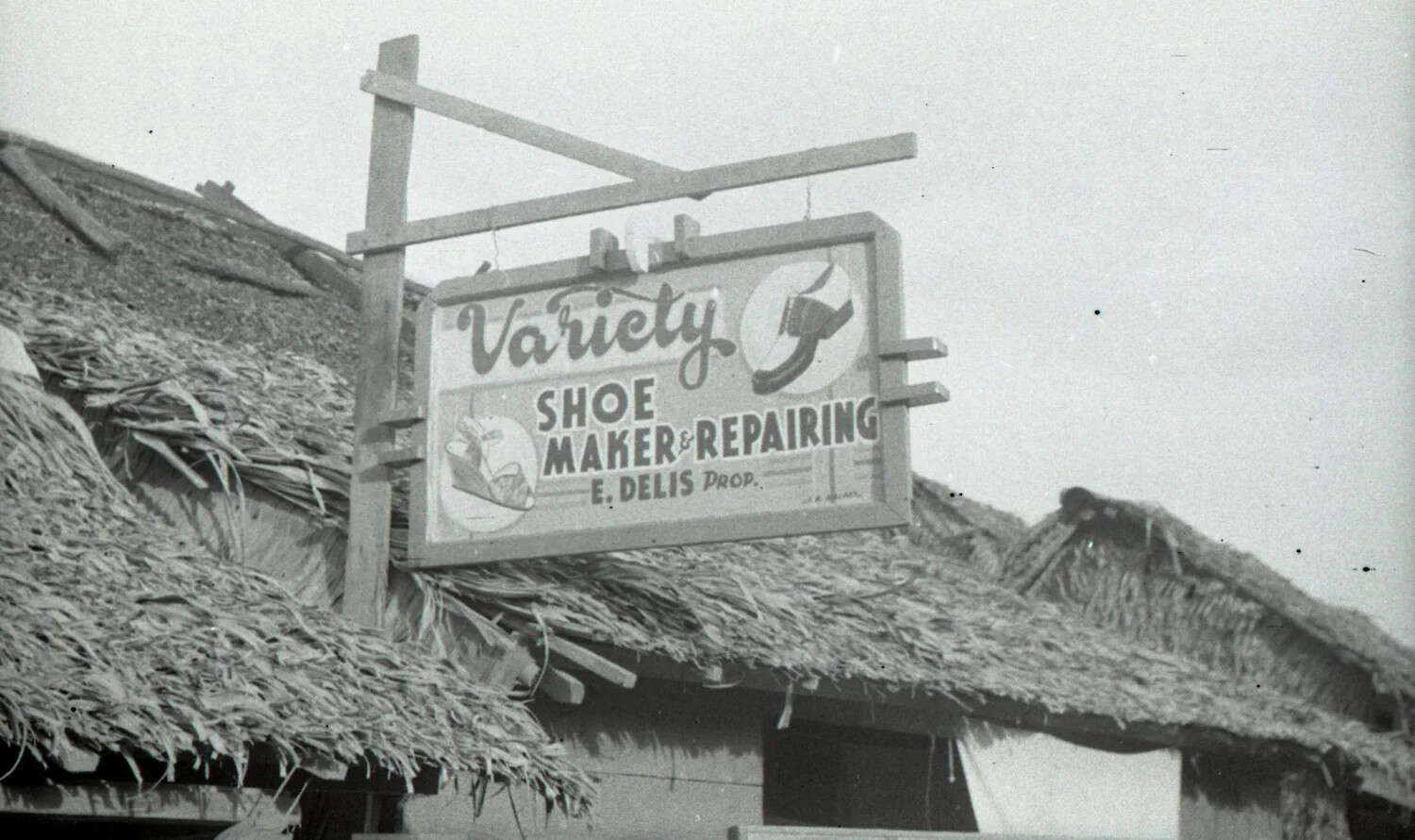 'Variety Shoe Maker & Repairing' Sign on Nipa Hut, Luzon, Philippines, WWII