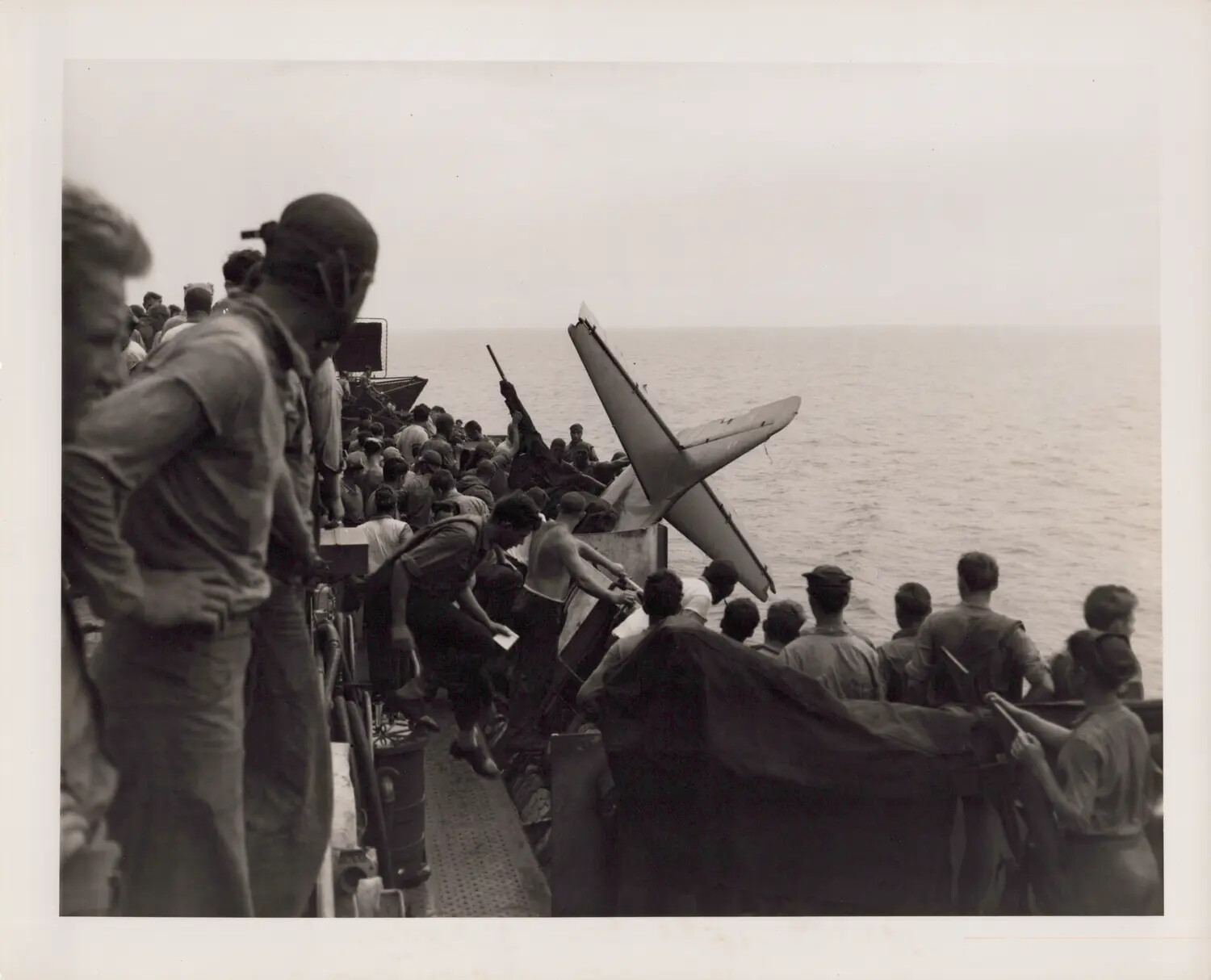 Tail of FM-2 Wildcat Bureau Number 57002 Lodged in 20mm Gun Sponson, U.S.S. Petrof Bay (CVE-80), December 18, 1944