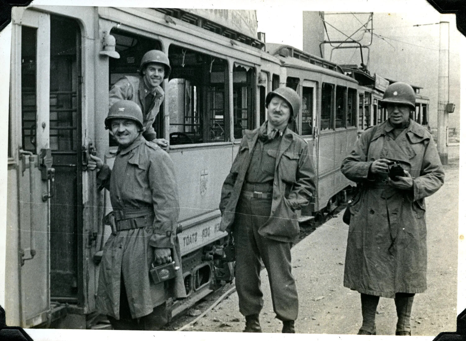 US Army Servicemen Posing with a European Streetcar, WWII Signal Corps Album
